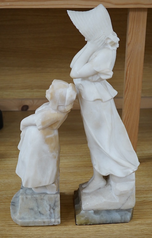 Two 20th century carved alabaster figures of young girls, one of a Dutch girl, the other larger, of a girl in a straw hat, 46cm high. Condition - Dutch girl good, girl with straw hat base broken to one corner